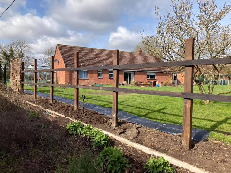 Post and rail fencing with raised beds