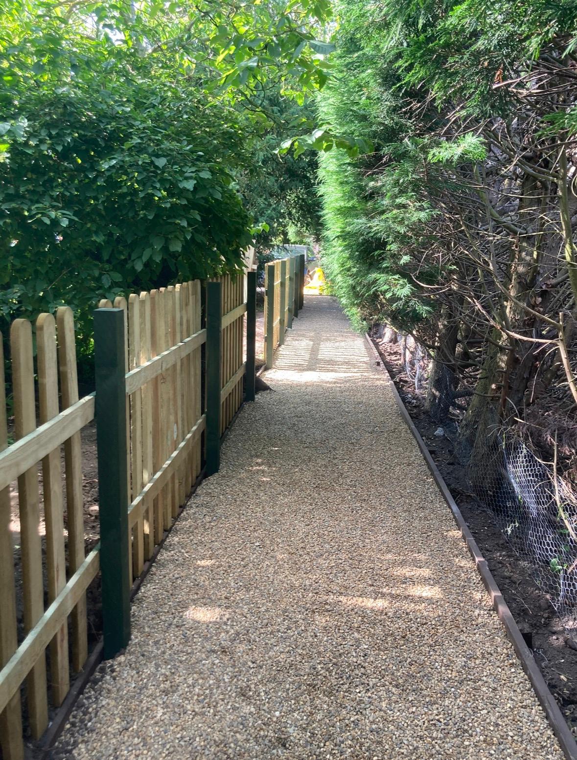 Gravel path with timber fencing