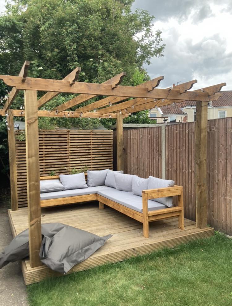 Pergola and outdoor seating area with decking